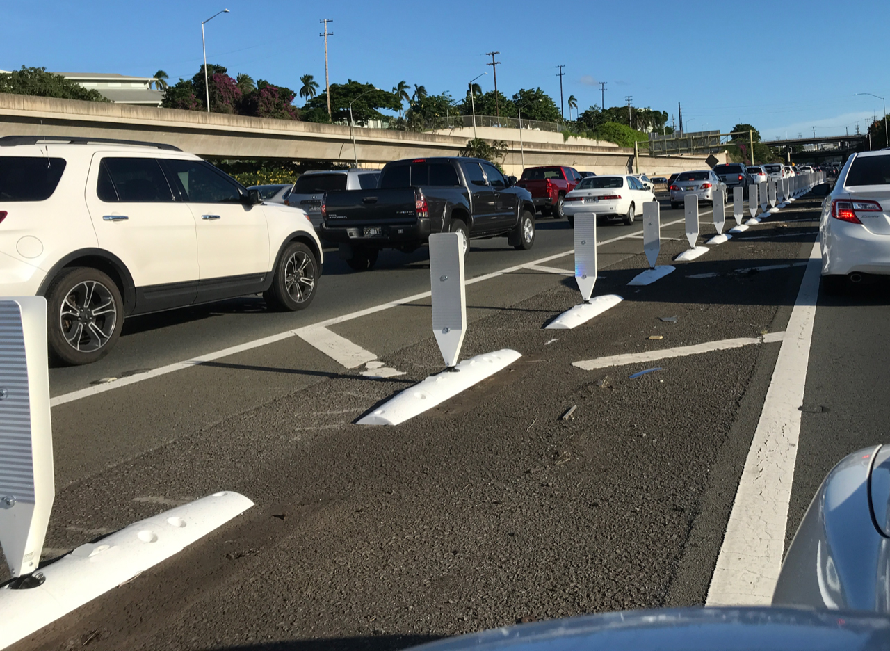 Traffic lane separators installed on a busy Hawaii roadway