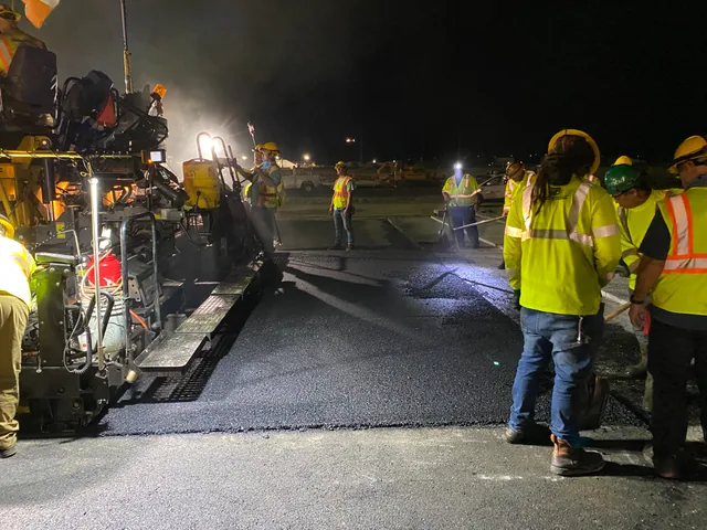 Runway paving crew working at night