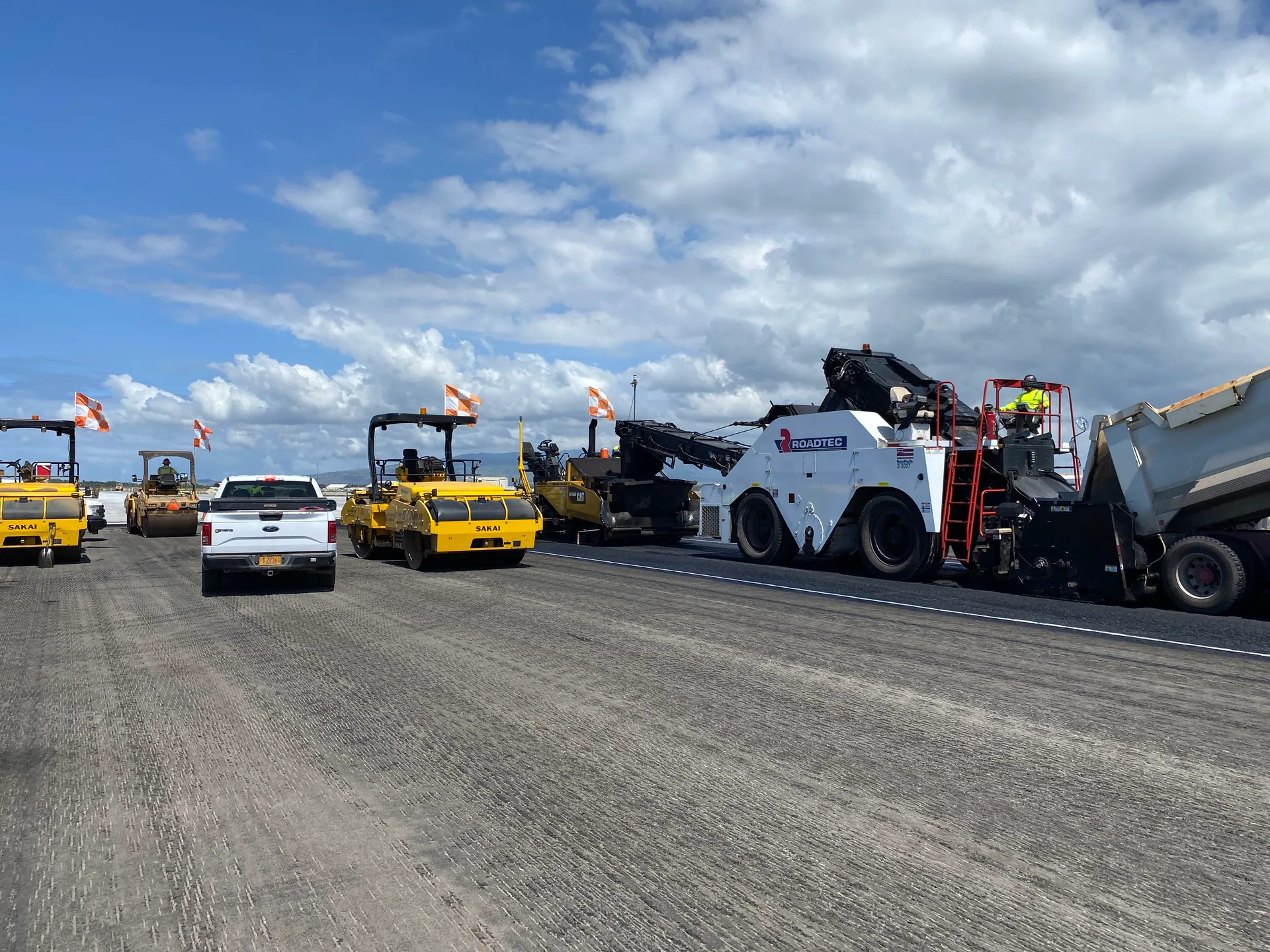 Grace Pacific equipment working across the runway at Honolulu Airport